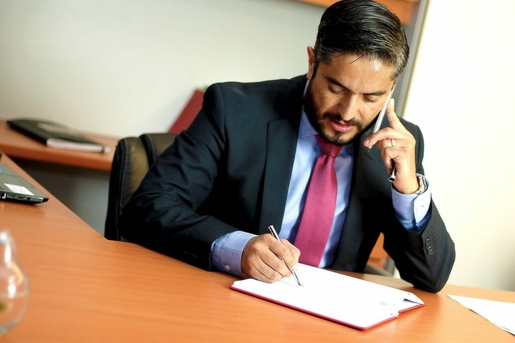 Businessman on the phone taking notes