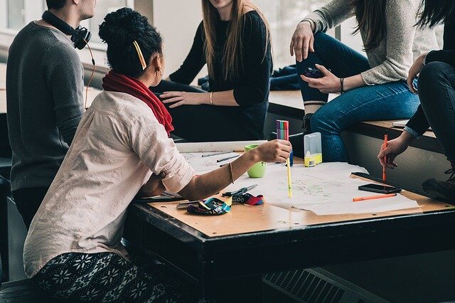 People gathered around a desk