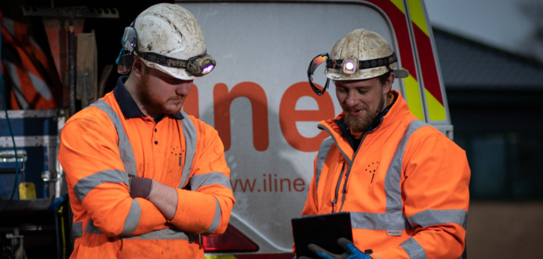 How much does SEO cost in the UK? Workmen searching on tablet for SEO costs