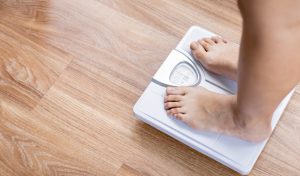 Feet on scales measuring weight myBMI Aqueous Digital European Search Awards finalists 2022