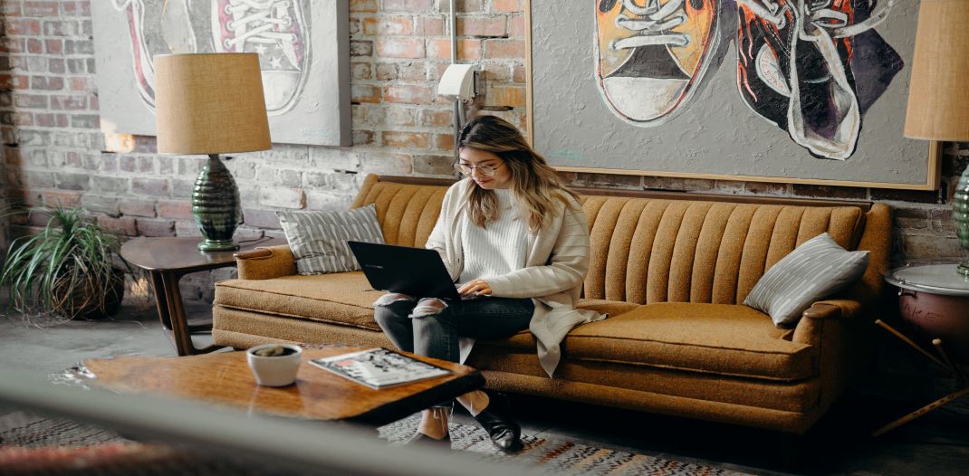 Girl sat down on laptop