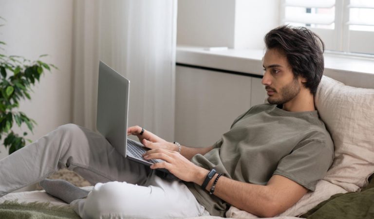 Man reviewing marketing strategy on laptop