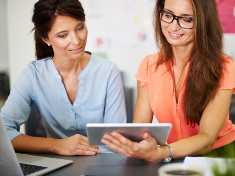 Two women using software and digital marketing to generate new leads