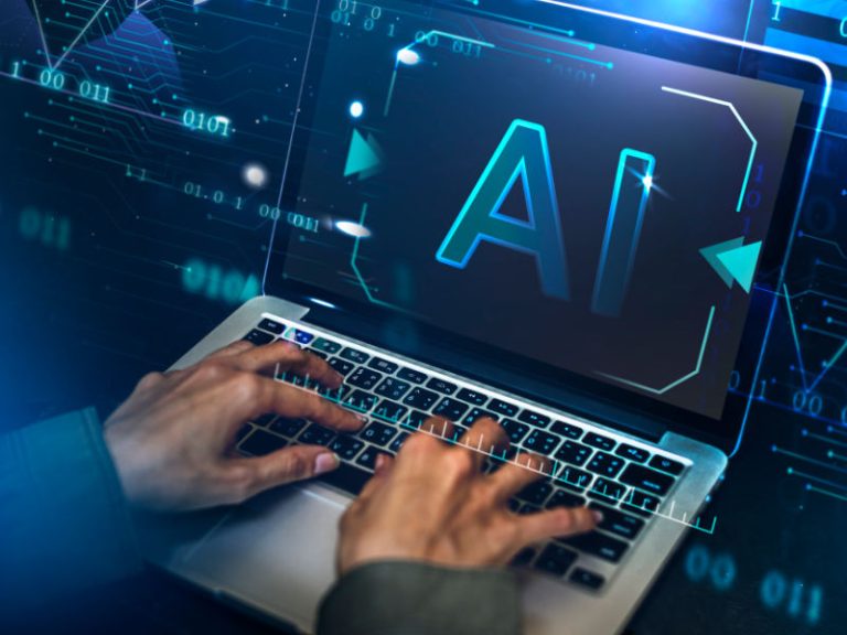 Man using AI to write article on laptop. Aqueous Digital AI blog feature image