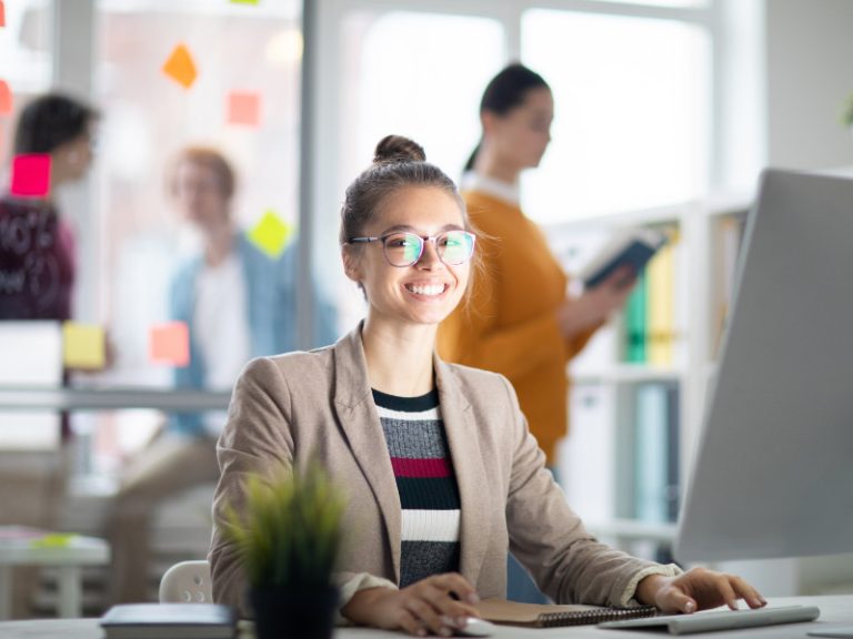 Woman inputting meta descriptions onto a PC