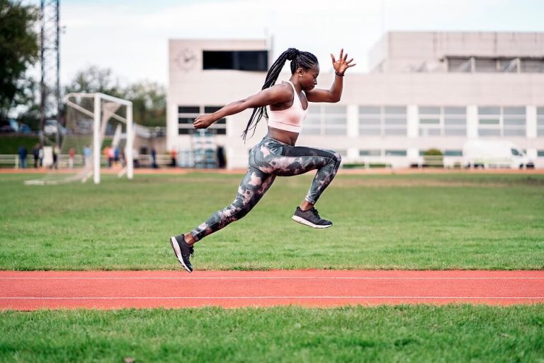 Woman running on a race track